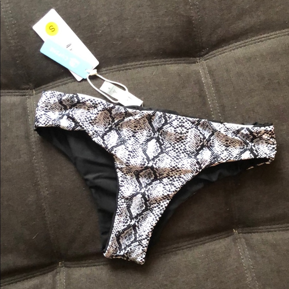 Bathing suit bottom (new) tags still attached.